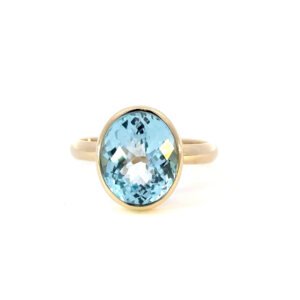 9K Yellow Gold Ring with an Oval Sky Blue Topaz