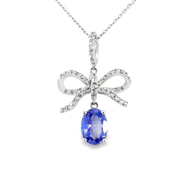 14K White Gold Bow Pendant with Oval Tanzanite 1.08 Carat and 48 Round Diamonds TDW 0.31 Carat