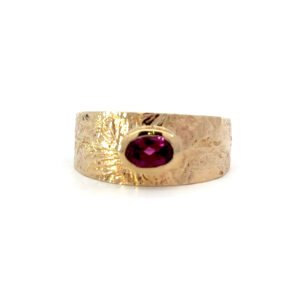 9K Yellow Gold textured Ring with a Rhodolite Garnet
