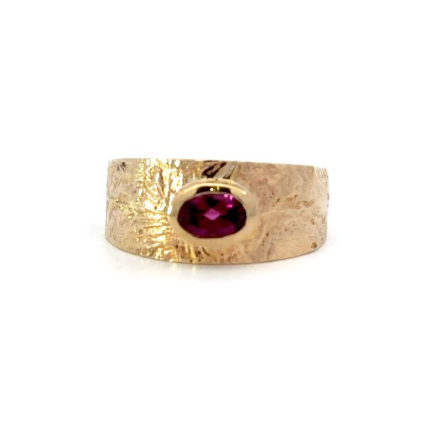 9K Yellow Gold textured Ring with a Rhodolite Garnet