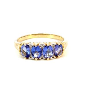 9K Yellow Gold Ring 4 Oval Tanzanites TCW 1.2 Carat White Diamonds TDW 0.02 Carat