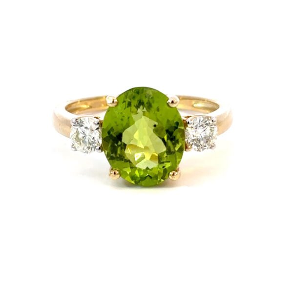 9K Yellow Gold Ring Oval Peridot 3.7 Carat 2 Round White Diamonds TDW 0.48 Carat